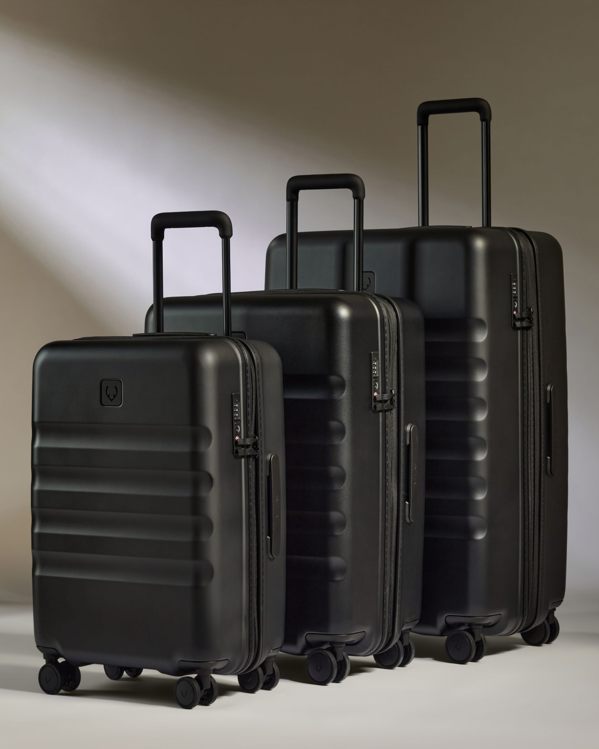 Away luggage black peirced aluminum