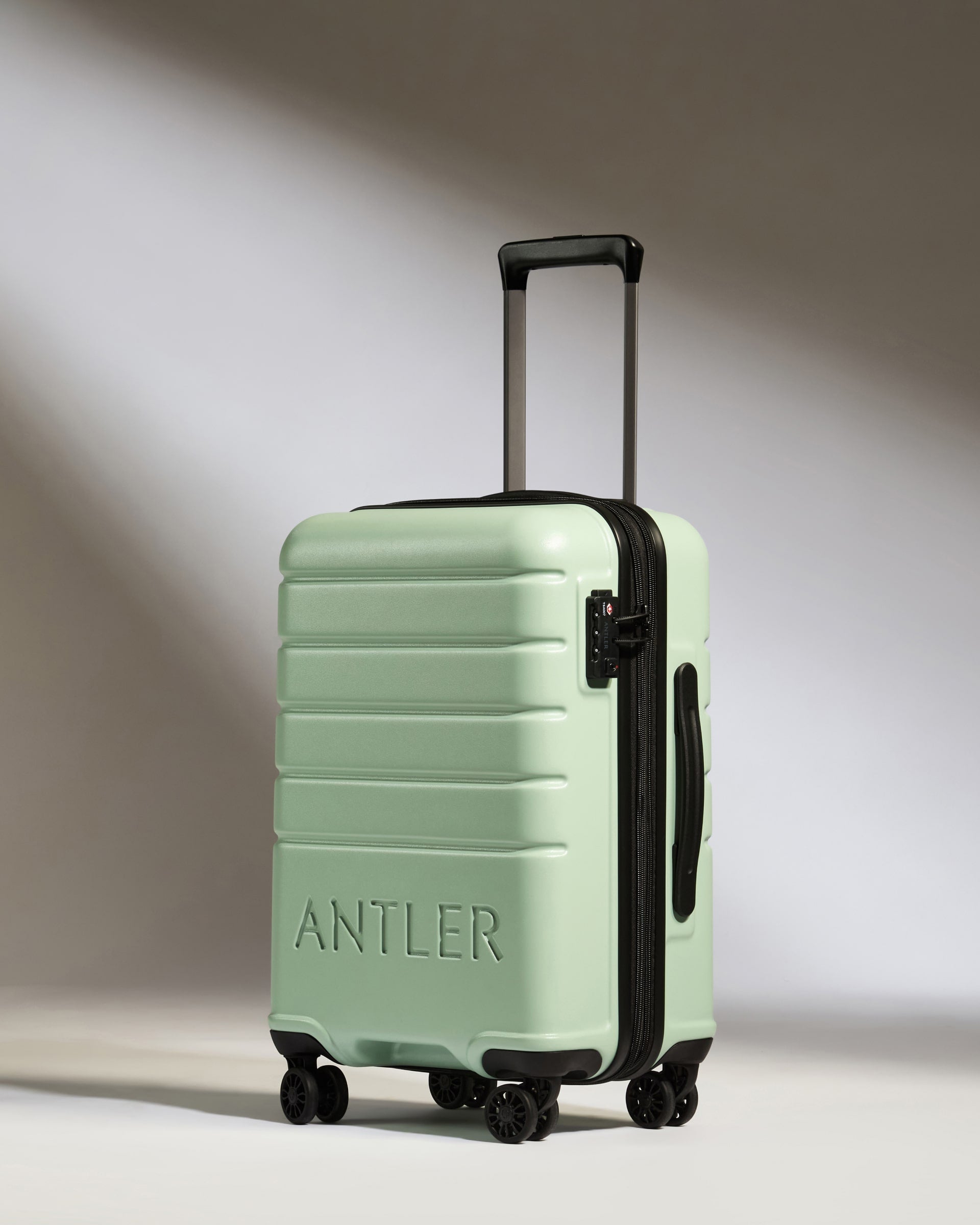 Expandable Carry on Luggage in Aspen Green Logo