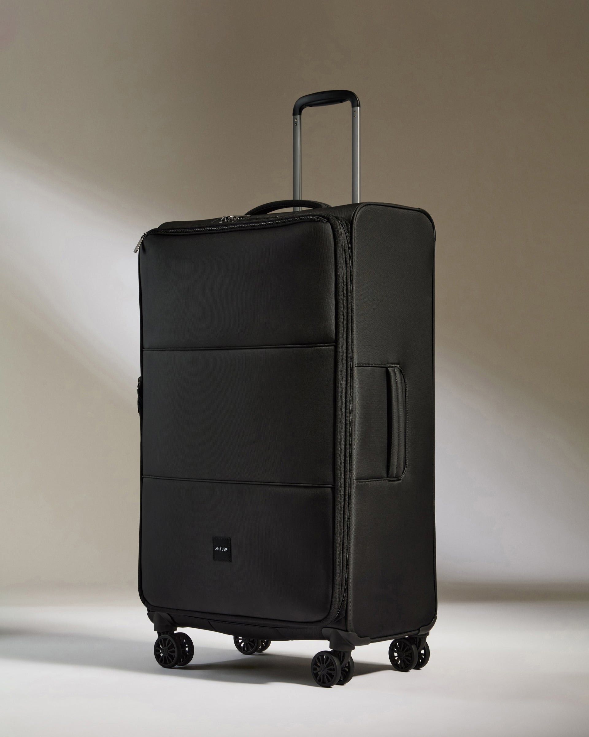 Lightest Large Suitcase in Black Soft Stripe