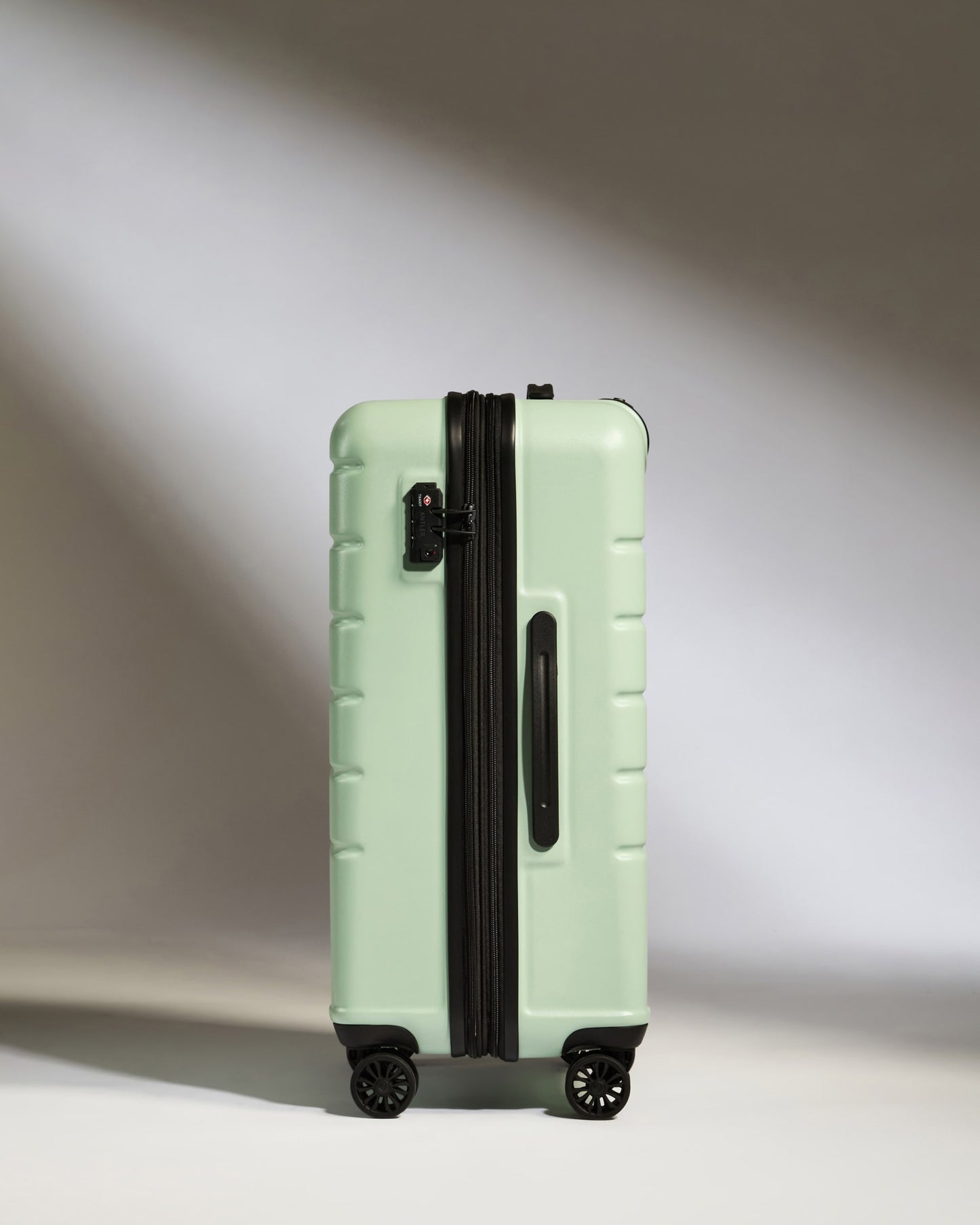 Medium Luggage in Aspen Green - Logo