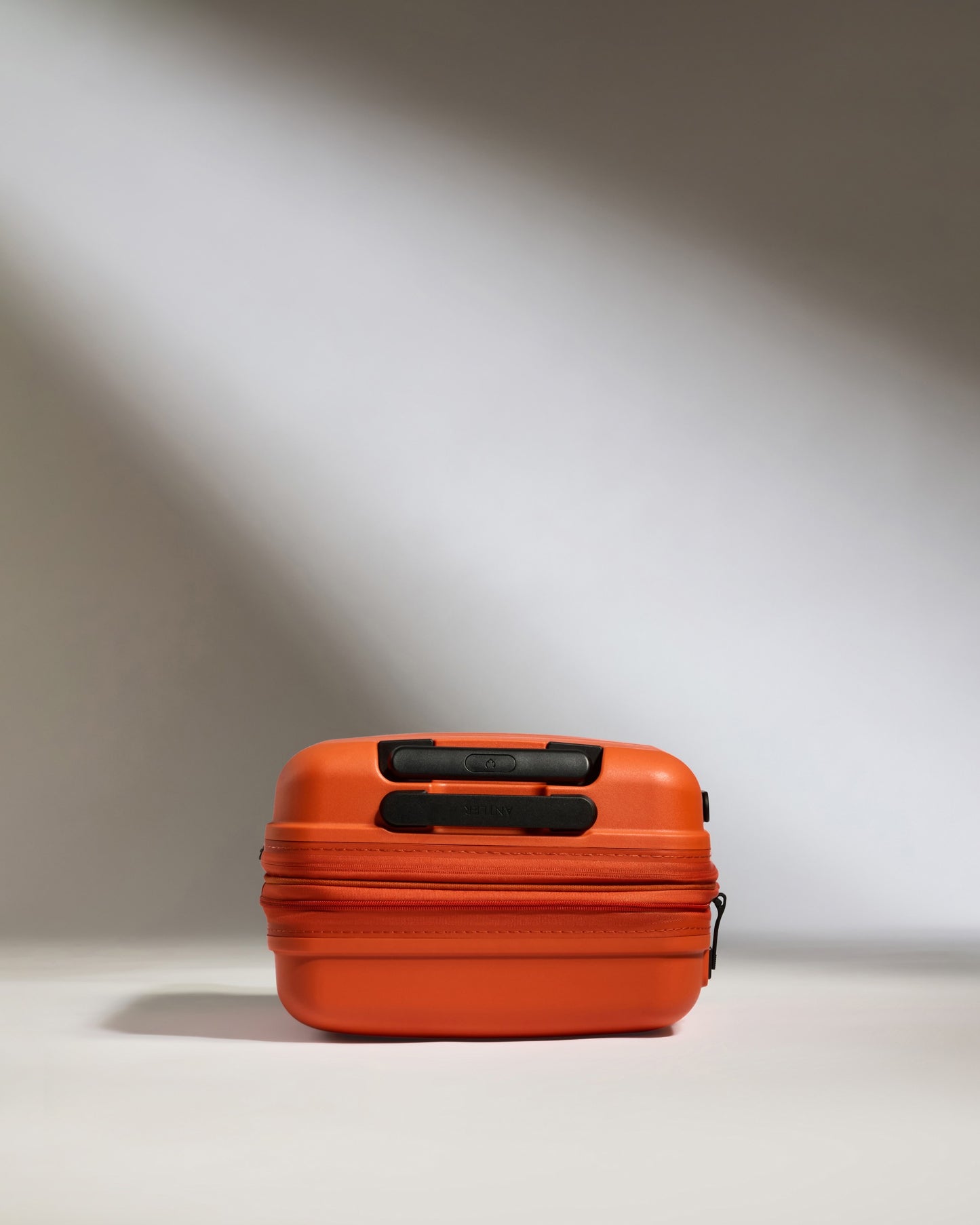 Expandable Carry-on Luggage in Ember Orange - Single Stripe